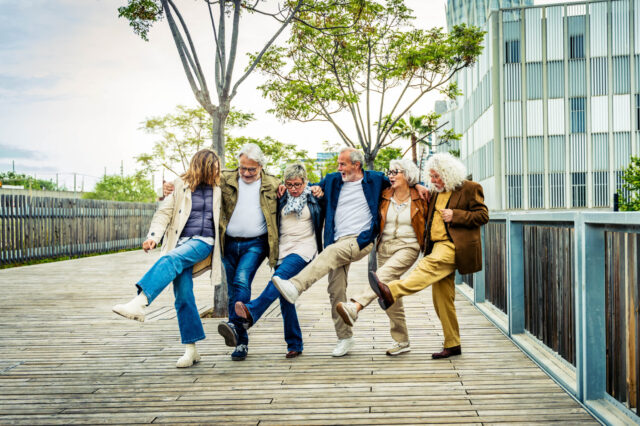 Healthy Longevity2: Happy group of senior people having fun walking outdoors